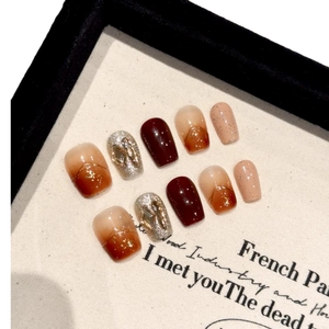 Handmade amber and wine red press-on nails set with glitter and silver diamond accents