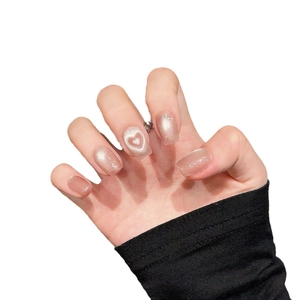 Pink cat eye press-on nails with 3D heart design and shimmering glitter finish