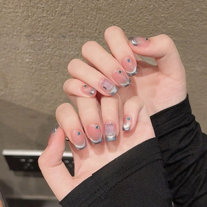 French smile cat-eye press-on nails with blue rhinestones and silver glitter tips