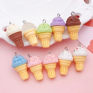 Detailed view of ten colorful miniature resin ice cream cone charms on a decorative tray