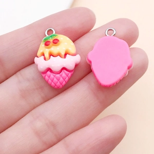 Detailed view of DIY resin ice cream charms with cherry detail and metal jump rings