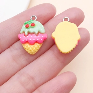 Close-up of resin cherry ice cream cone charms showing front and back details for DIY crafts