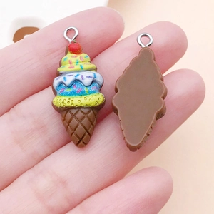 Detailed view of DIY resin strawberry ice cream cone pendant with metal loop and flat back