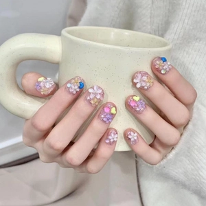 Handmade cream floral press-on nails with 3D embossed flowers and pearl accents