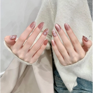 Pink brown cat eye press-on nails with white rose floral design for elegant look