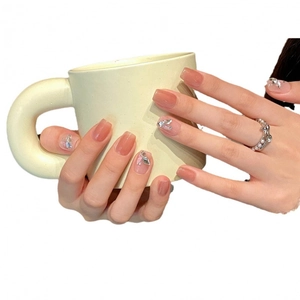 Handmade cat eye press-on nails in pink with silver rhinestones and glitter details