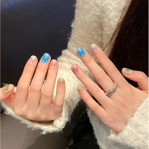 Short handmade press-on nails with 3D butterfly charms in macaron pastel colors