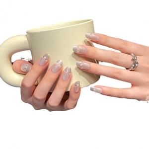 Handmade cat eye press-on nails in purple with pearls and silver glitter accents