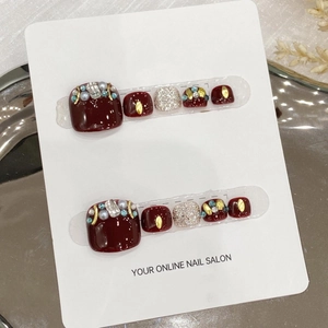 Handmade press-on toenails in burgundy and champagne silver with pearls and rhinestones