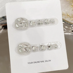 Sparkling silver handmade press-on toenails with glitter and rhinestone accents