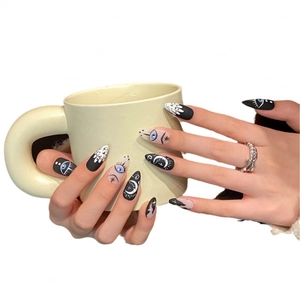 Handmade stiletto press-on nails featuring gothic mystic eye and crescent moon designs