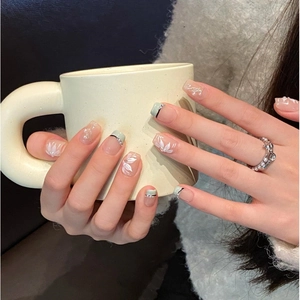 Handmade light green French press-on nails with hand-painted floral patterns and pearls