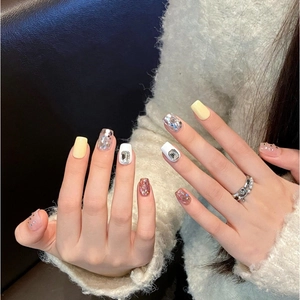 Luxurious handmade press-on nails with sparkling rhinestones and silver glitter finish