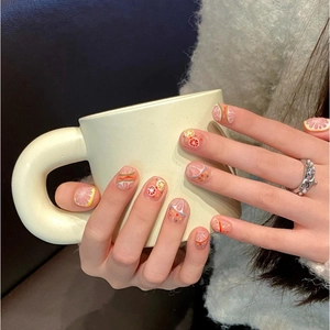 Handmade citrus-themed press-on nails with lemon and grapefruit patterns for a fresh summer look