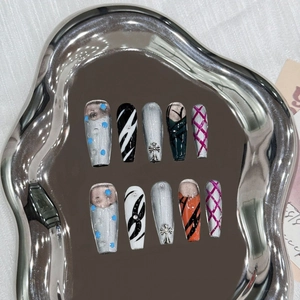 Handmade press-on nails with silver cat-eye, metal cross, and artistic anime-inspired design