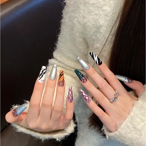Handmade coffin press-on nails with Y2K metallic, leopard print, and rhinestone designs