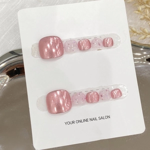 Handmade press-on toenail set featuring pink cat-eye effects and iridescent glitter flakes