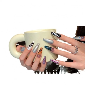 Handmade long coffin press-on nails with silver metallic accents and mixed patterns