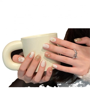 Handmade press-on nails with gold foil, 3D floral designs and elegant pearl accents