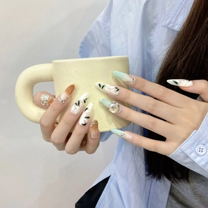 Handmade long almond press-on nails with brown-green gradient and white floral hand-painting