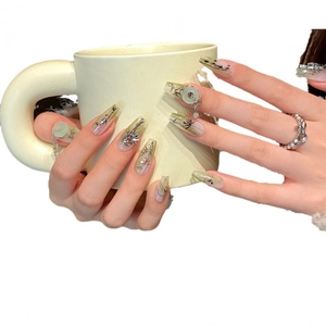 Green jade style press-on nails with bamboo hand-painting and long coffin shape
