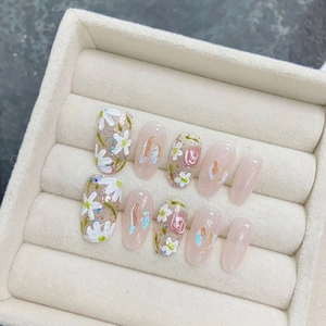 Handmade press-on nails set featuring 3D white magnolia and pink rose marble patterns