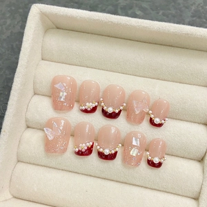 Handmade press-on nails with red pearls and transparent 3D butterfly ornaments