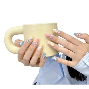 Handmade 3D textured matte press-on nails in pastel macaron colors with artistic design