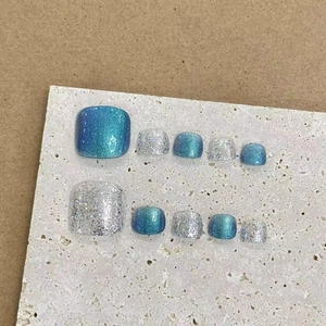 Handmade blue cat-eye and silver glitter press-on toenails set in a luxury finish
