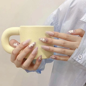 Handmade purple floral almond press-on nails with 3D flower art and silver glitter