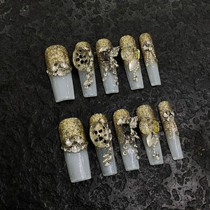 Handmade long ballerina press-on nails with gold glitter gradient and luxury 3D gems