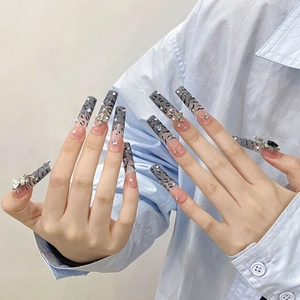 Extra-long leopard print gradient press-on nails with 3D cross and rhinestone accents