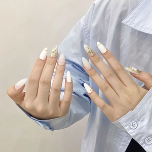 Handmade almond press-on nails with white cat-eye finish, pearls and crystal accents