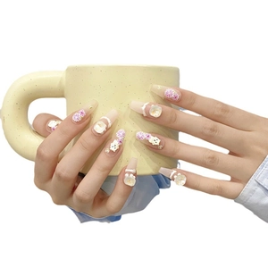 Handmade 3D cartoon press-on nails with cute bears and floral charms on a long coffin shape
