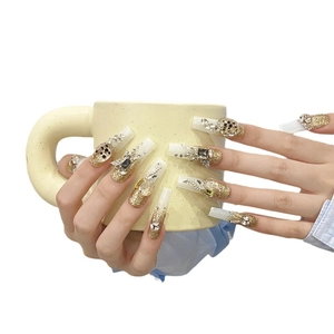 Extra long coffin press-on nails with luxury gold glitter gradient and crystal rhinestones