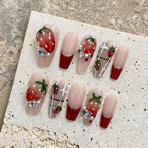 Handmade strawberry press-on nails with 3D fruit art, pearls and French tip design