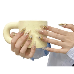Handmade almond press-on nails with gold foil, 3D floral accents and crystal rhinestones