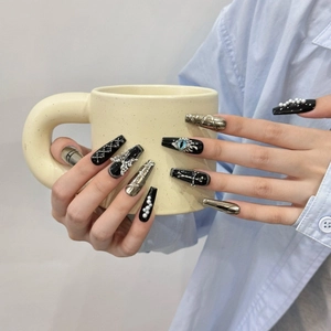 Handmade Gothic press-on nails in black and silver with 3D eye and cross charms