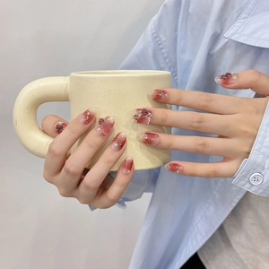 Handmade burgundy rose press-on nails with 3D floral accents and pearl details