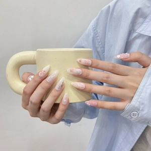 Handmade almond press-on nails with pink blush, 3D floral accents and pearl details