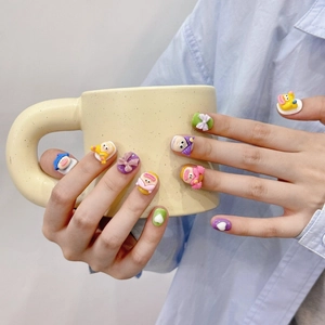 Handmade 3D cartoon press-on nails featuring cute sausage-mouth characters and vibrant art