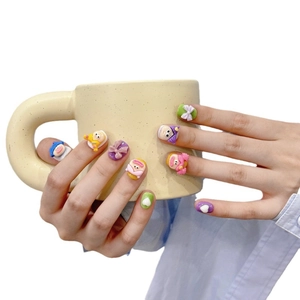 Handmade 3D cartoon press-on nails with cute character designs and colorful 3D bow accents