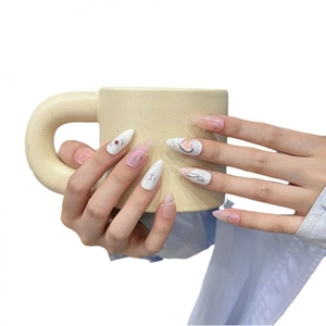 Handmade almond press-on nails with pink gradients, silver hearts, and red rhinestones