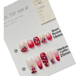 Christmas theme press-on nails with red gradient snowflakes and 3D tree design