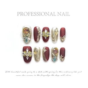 Luxury handmade press-on nails set with burgundy matte finish and sparkling crystals