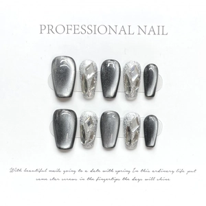 Handmade cat eye press-on nails in grey with silver glitter and 3D geometric rhinestones