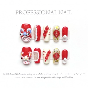 Handmade red lion dance press-on nails with 3D elements and gold foil accents