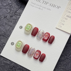 Handmade red and silver glitter press-on nails with mahjong art and crystal accents