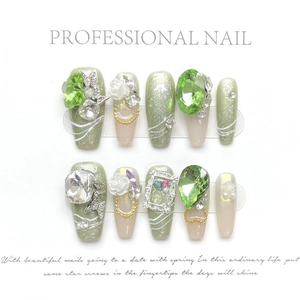 Handmade summer olive green press-on nails with cat-eye effect and luxury 3D gemstone charms