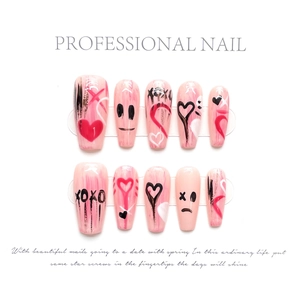 Detailed view of hand-painted gradient pink press-on nails with XOXO graffiti designs